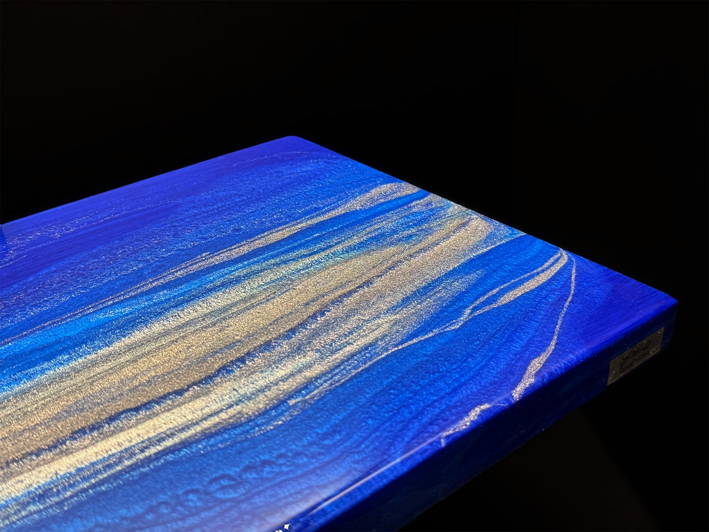 Modern furniture piece with a blue abstract waves design