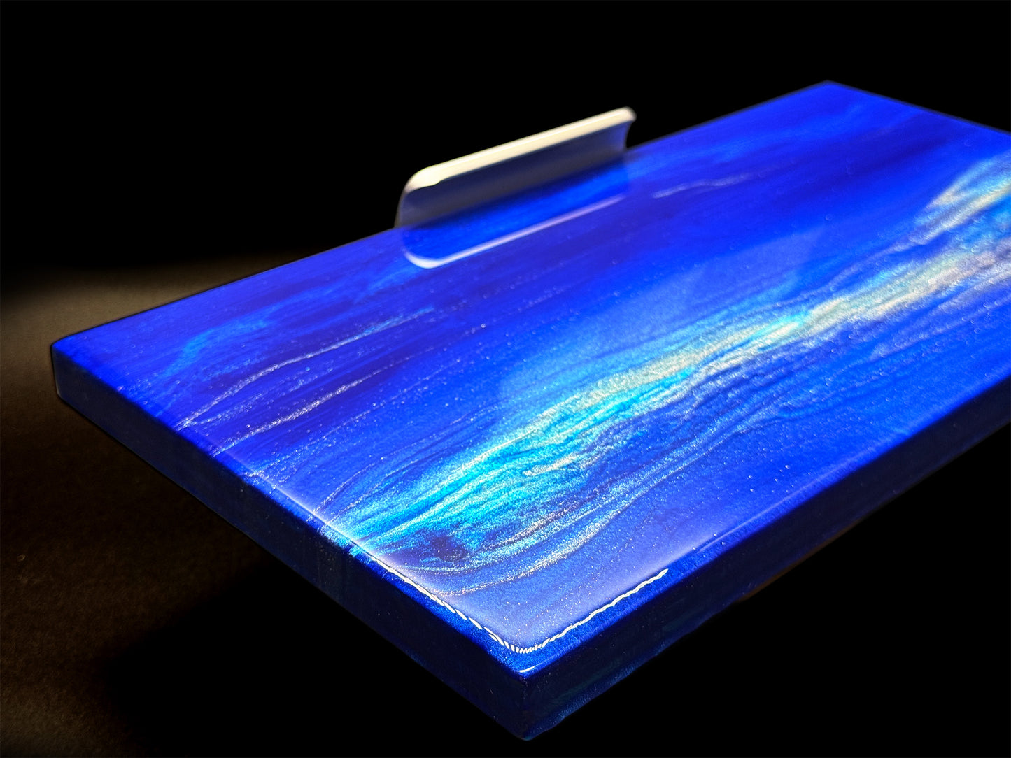 Modern furniture piece with a blue abstract waves design