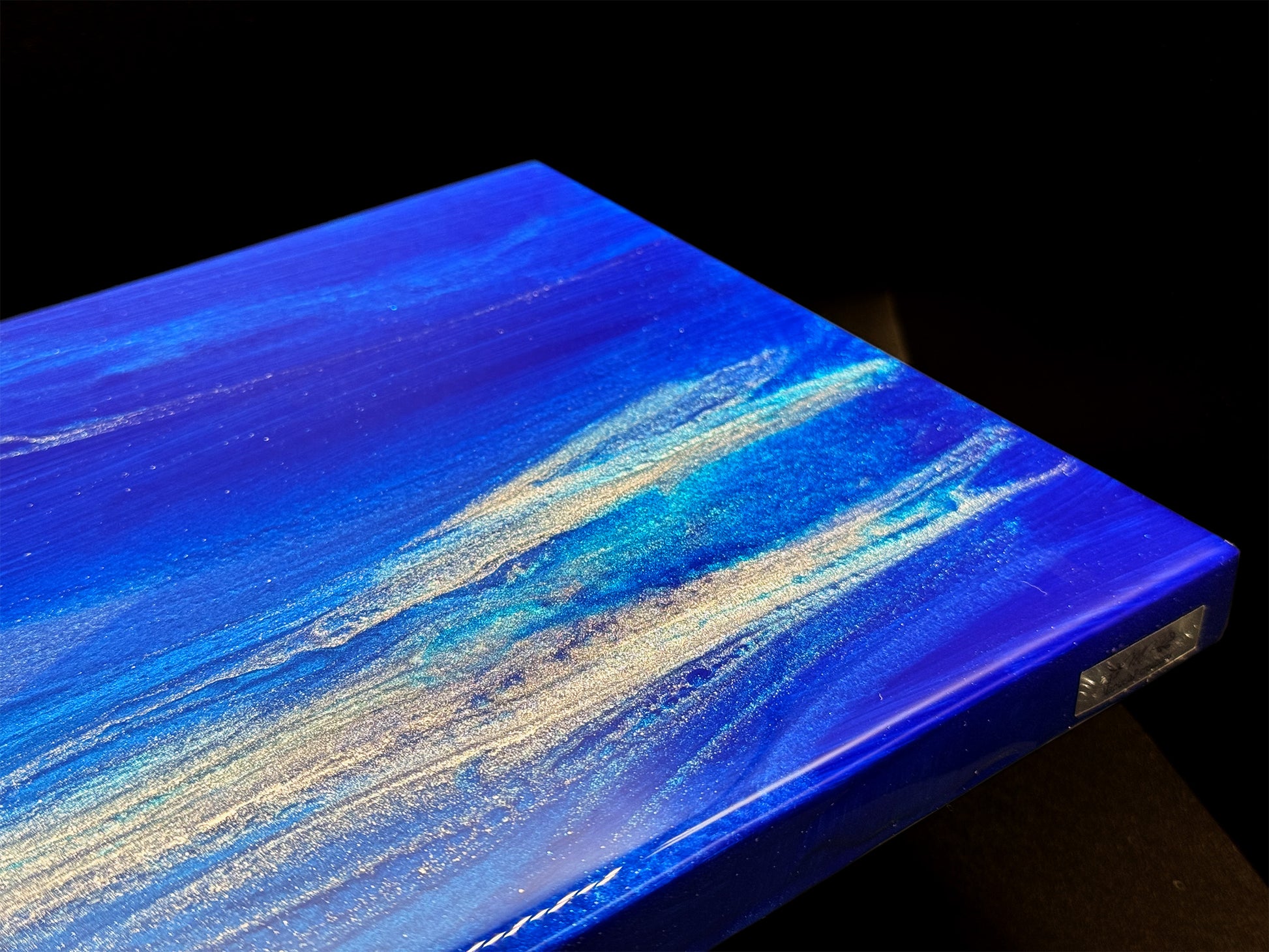 Modern furniture piece with a blue abstract waves design