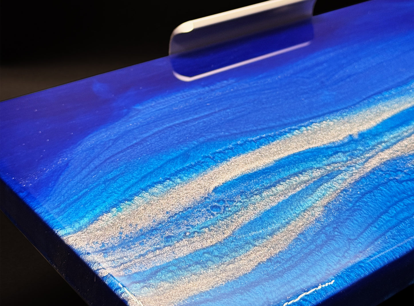 Modern furniture piece with a blue abstract waves design