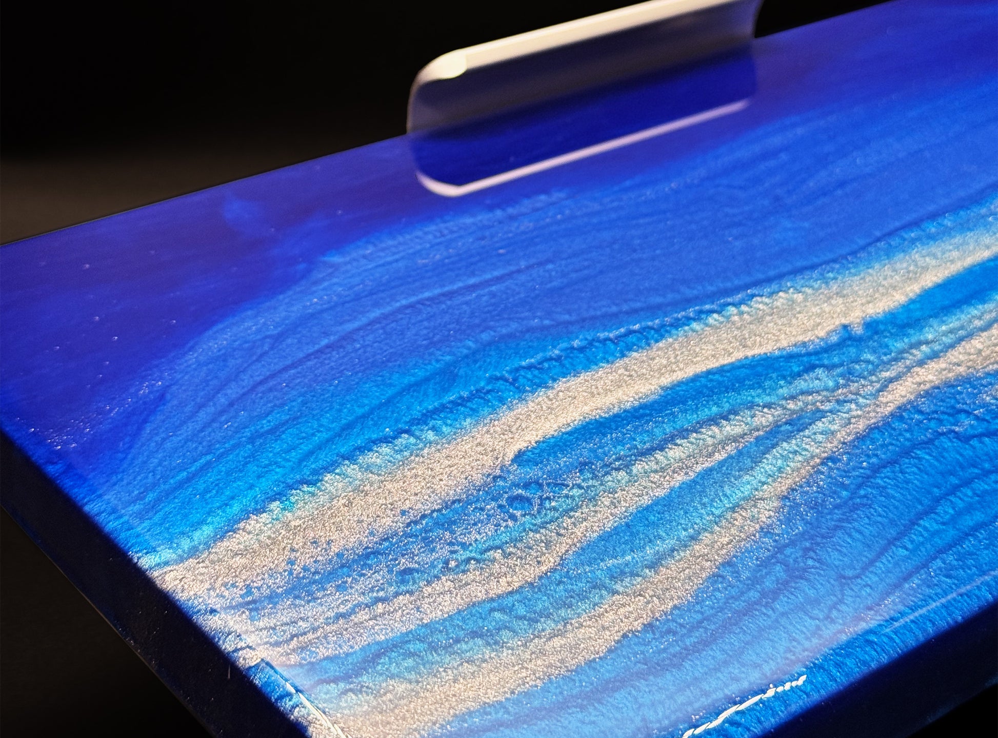 Modern furniture piece with a blue abstract waves design