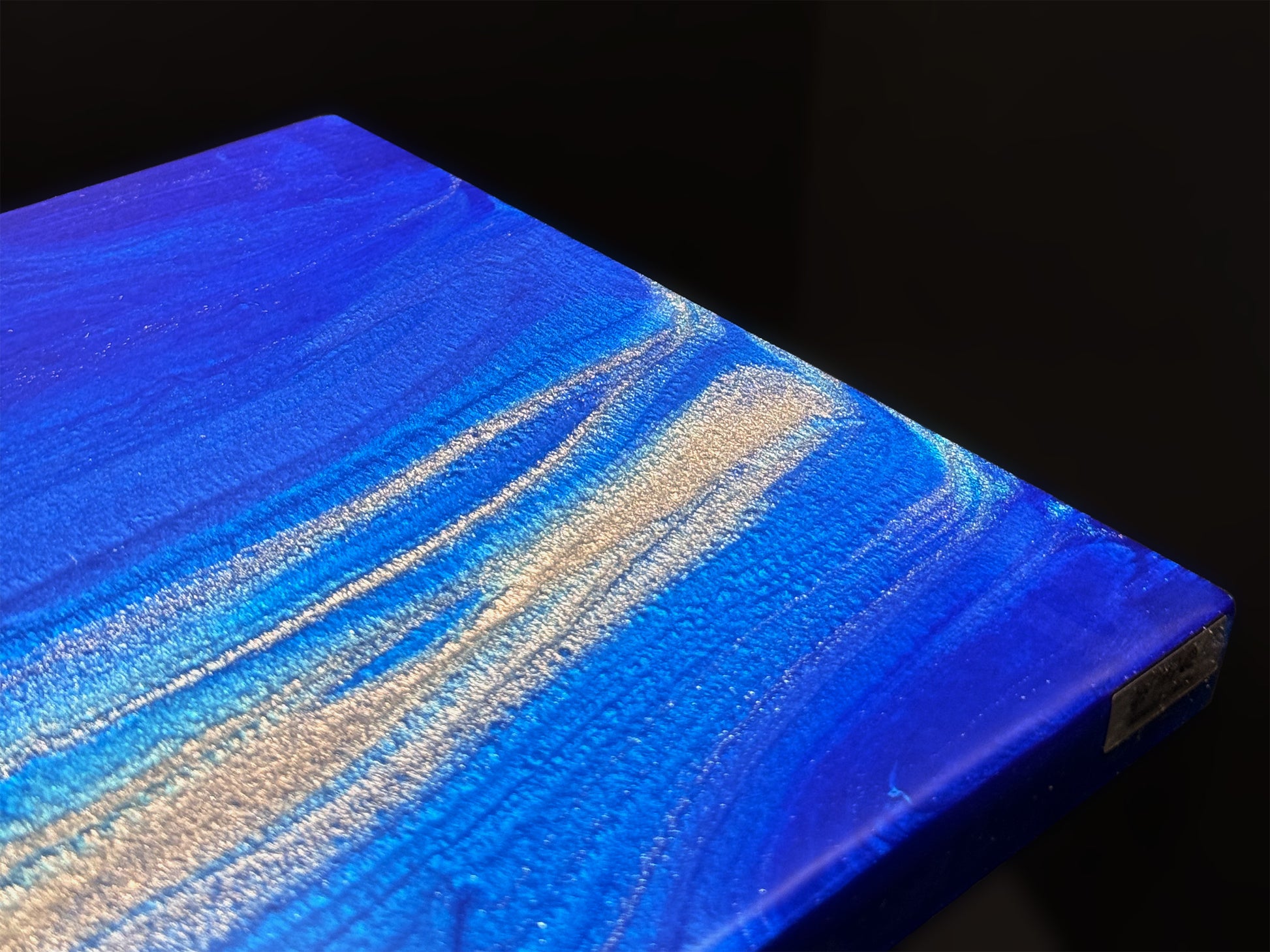 Modern furniture piece with a blue abstract waves design
