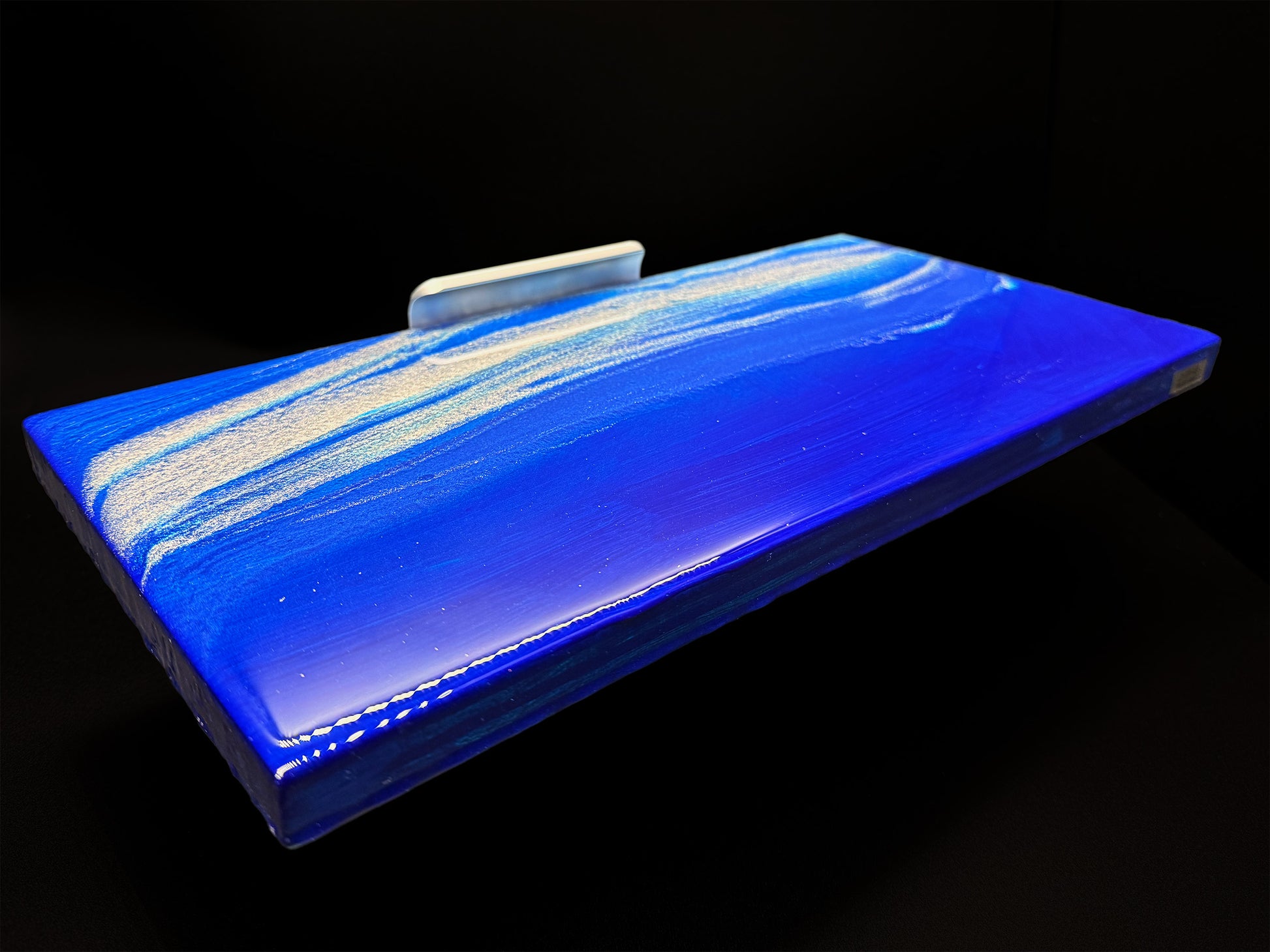 Modern furniture piece with a blue abstract waves design