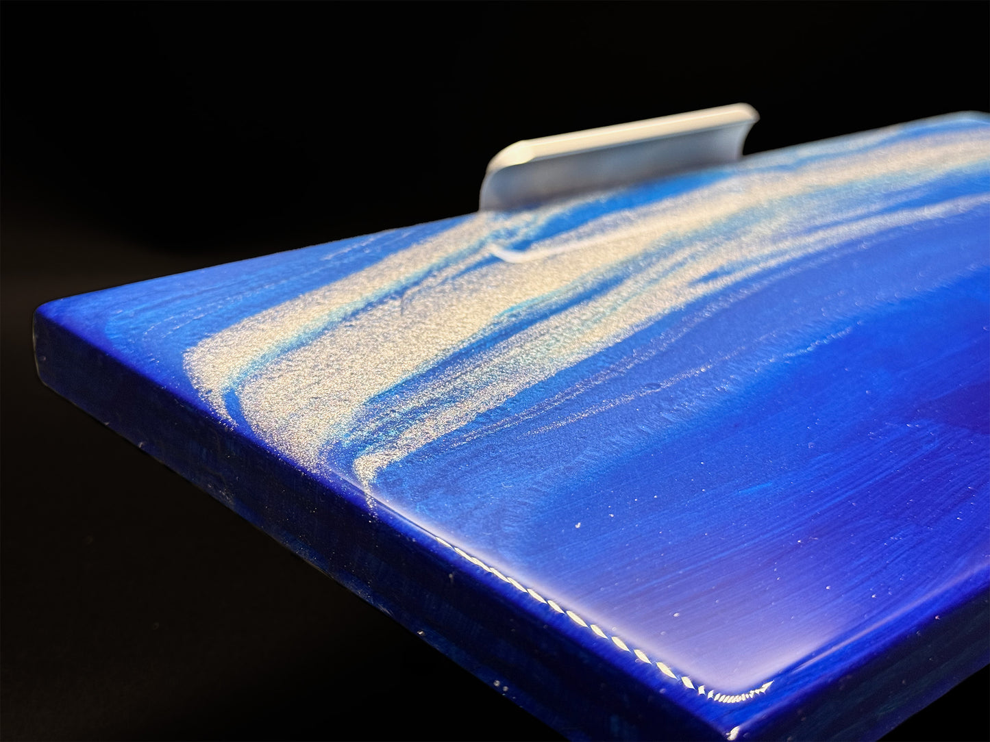 Modern furniture piece with a blue abstract waves design