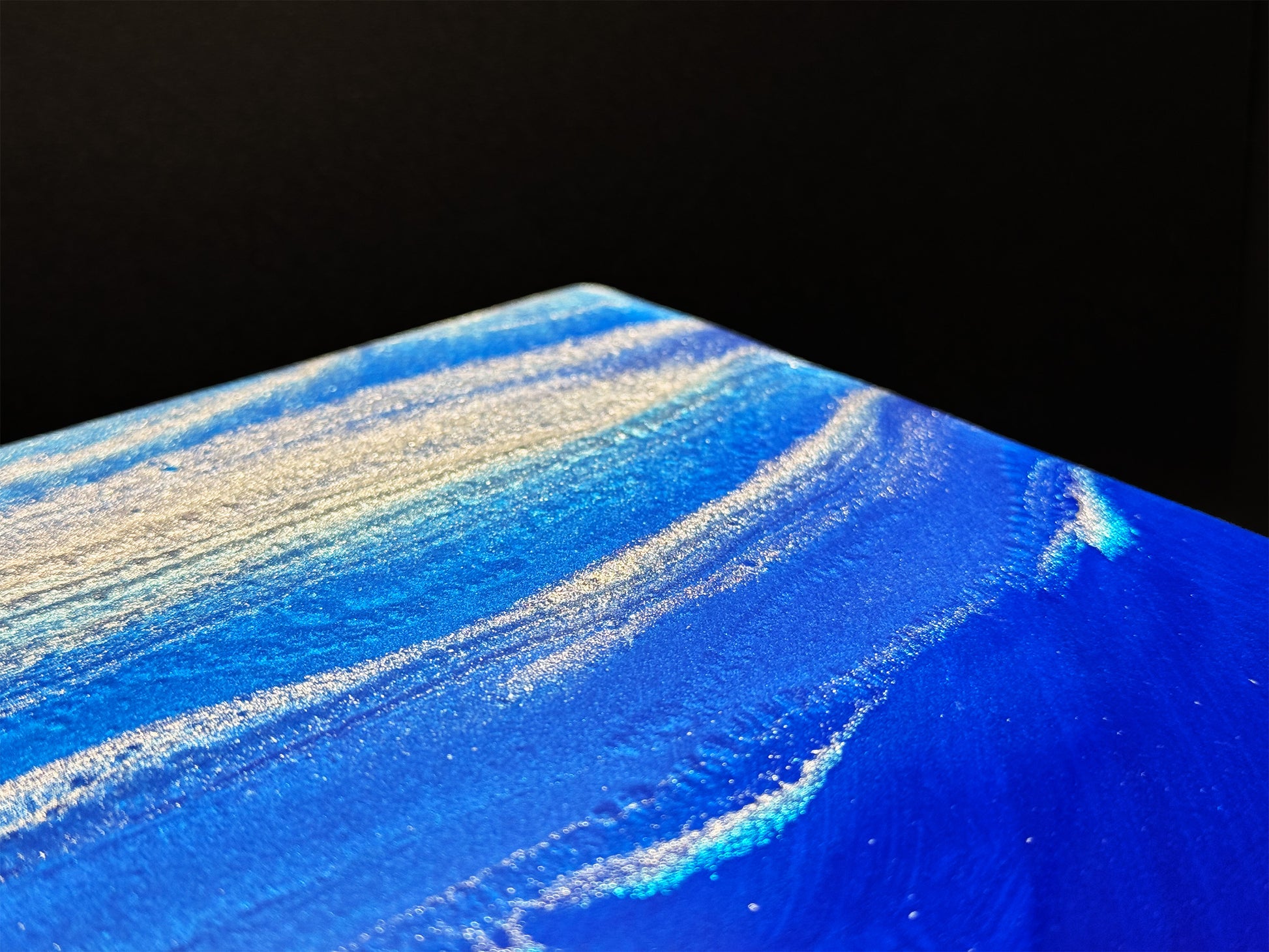 Modern furniture piece with a blue abstract waves design