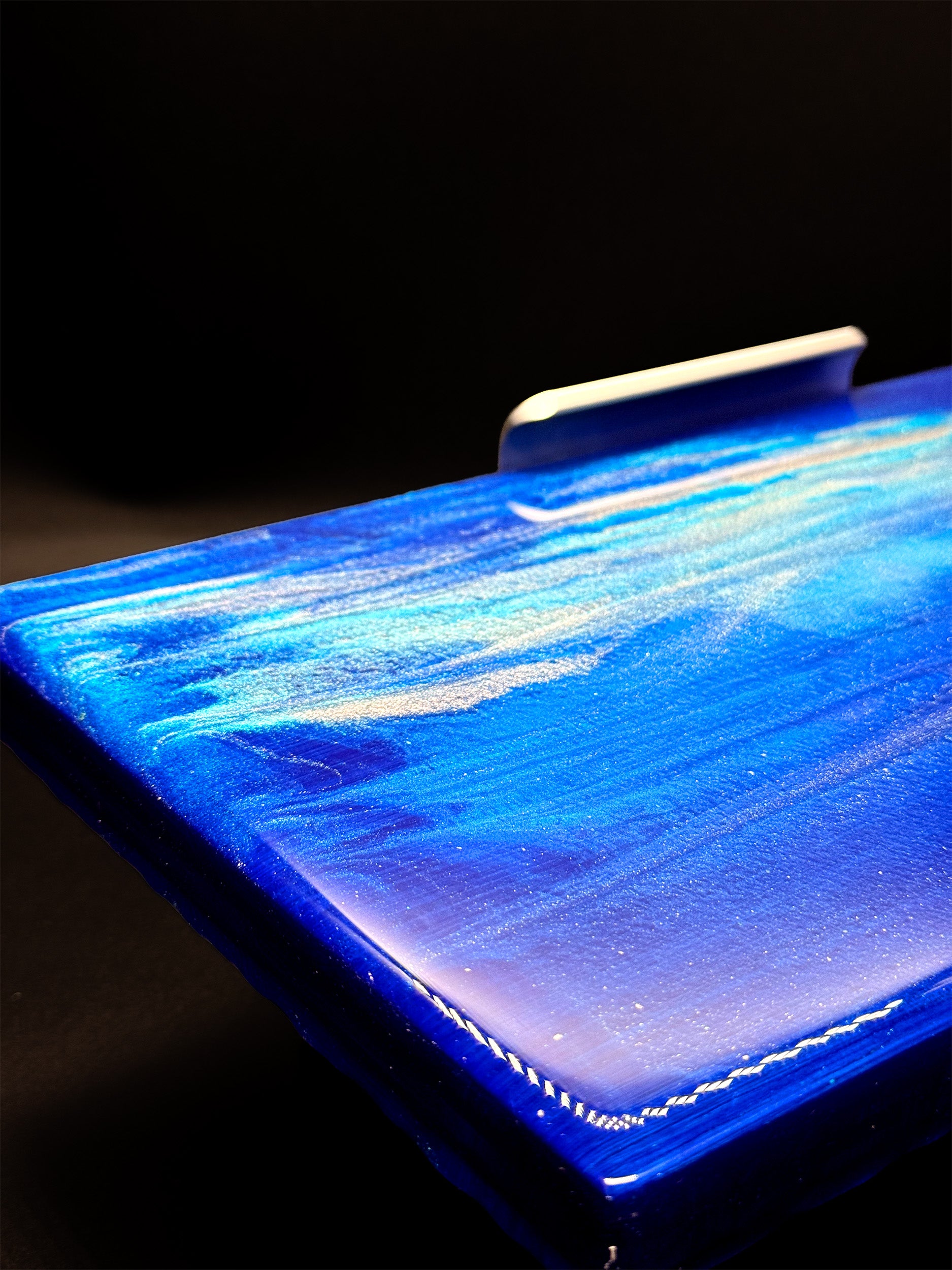 Modern furniture piece with a blue abstract waves design