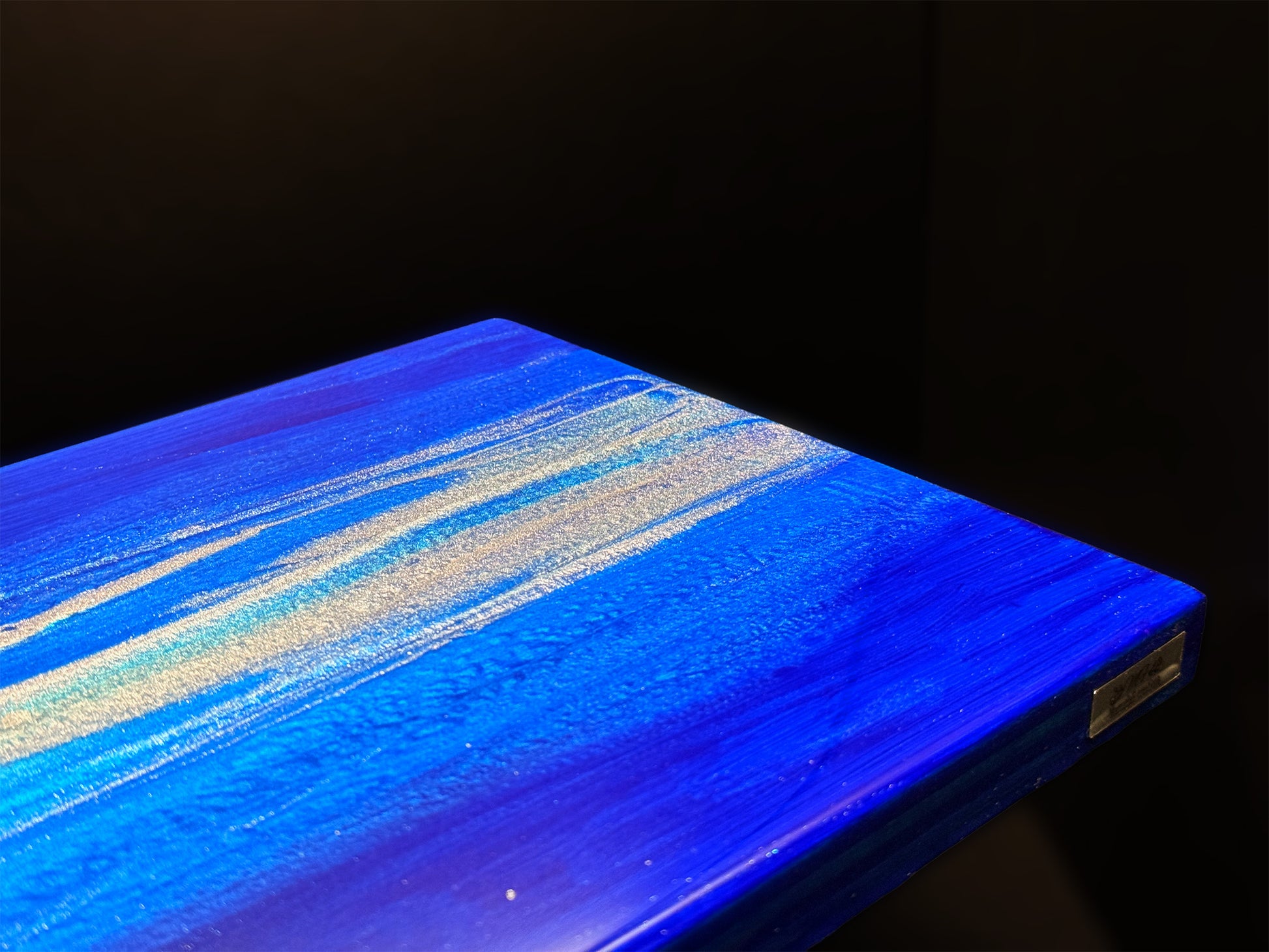 Modern furniture piece with a blue abstract waves design