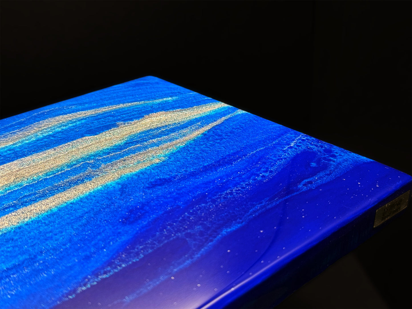 Modern furniture piece with a blue abstract waves design