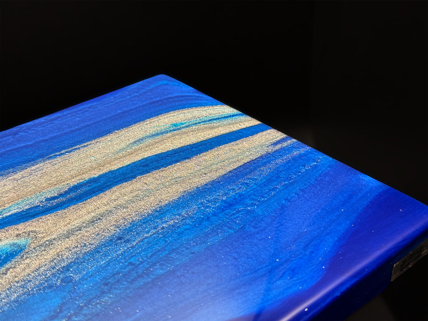 Modern furniture piece with a blue abstract waves design