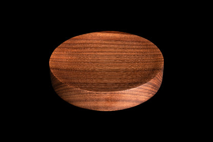 Dark circular spoon rest with concave center