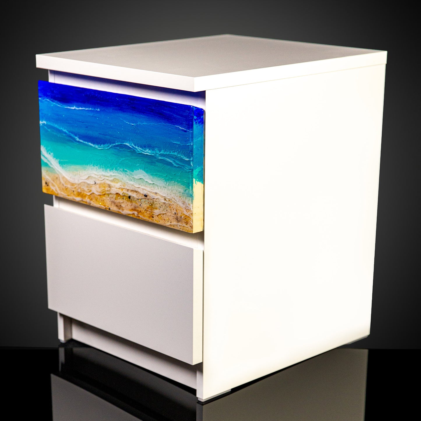 One ocean art piece installed on a white cabinet