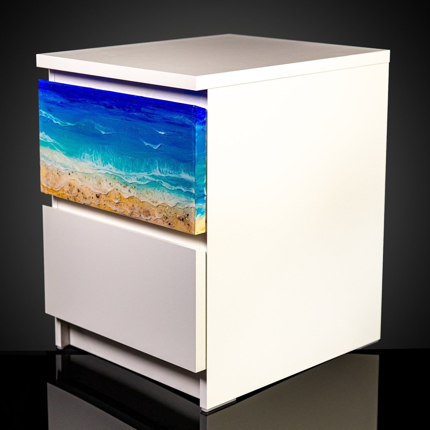 One ocean art piece installed on a white cabinet