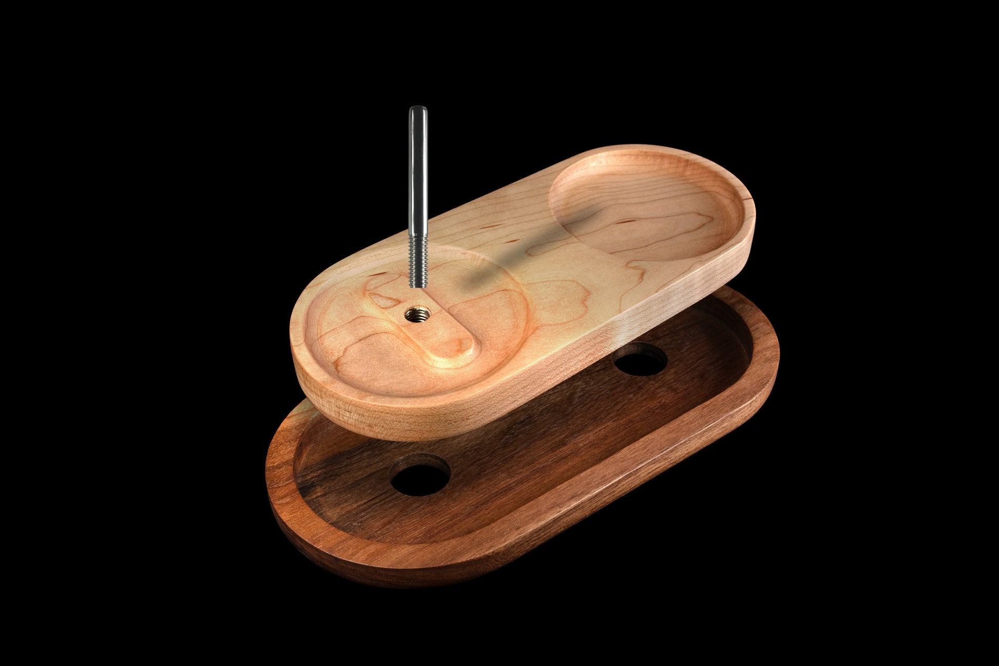 Ring tray with metal pin floating above wood tray above wood base